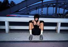 Running insights, athlete resting after run, urban background, fitness and training recovery concept, modern athletic lifestyle.