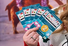 1. Close-up of a person holding Love2Shop gift cards, showcasing multiple cards with various store logos, ideal for gift card giveaways and retail promotions in the UK.