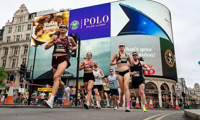 Runners participating in the London Marathon, showcasing determination and athleticism in a vibrant city setting.