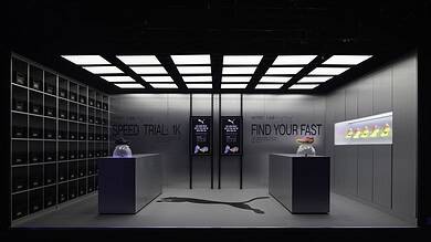Modern PUMA Nitro Lab store display showcasing innovative running shoes in a sleek, high-tech environment during London marathon weekend.