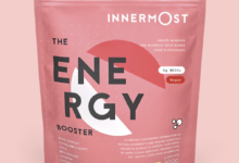 Pink Innermost Energy Booster vegan supplement pouch with BCAA, gluten-free, low sugar, and lactose-free, designed to support race preparation and recovery.
