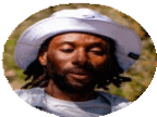 Close-up of a man wearing a wide-brimmed hat and running gear, with a scenic outdoor background, representing running and outdoor fitness.