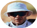A runner wearing a white hat and sunglasses during an outdoor run, capturing the essence of running fitness and outdoor training.