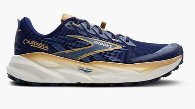 Brooks Cascadia trail running shoes in navy blue with beige and gold accents, designed for outdoor trail running and stability.