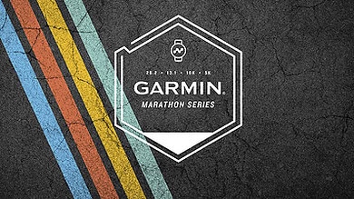 Garmin Marathon Series logo on a textured dark background with colorful stripes, promoting running events and marathon tracking technology.