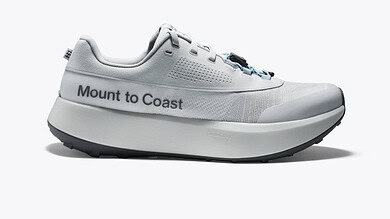 Light grey Mount to Coast running shoe with breathable mesh, cushioned midsole, and bold branding along the side.