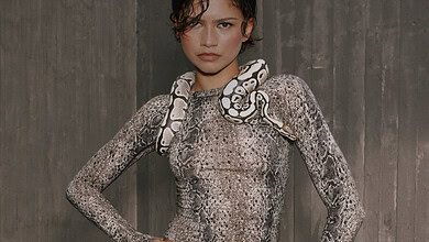 Zendaya poses confidently with a snake draped over her shoulders, showcasing her bold fashion style for the new co-created collection with On and Zendaya.