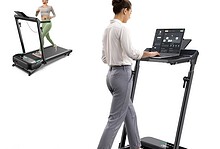 Woman using a high-tech treadmill for running and workout at home or gym, with a focus on fitness and exercise.